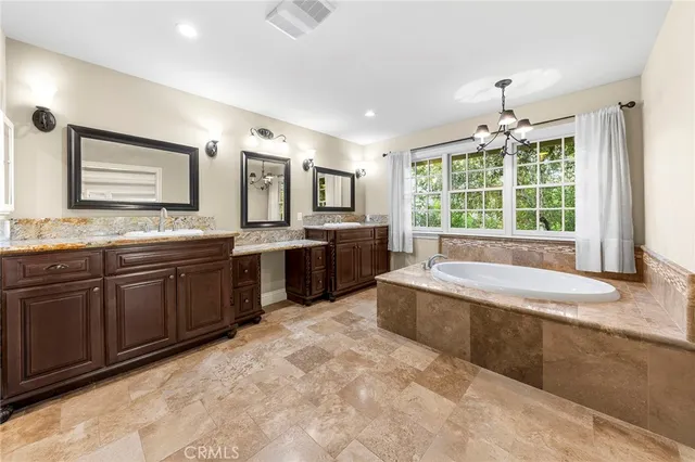 a view of patio with table and chairs under an umbrella
