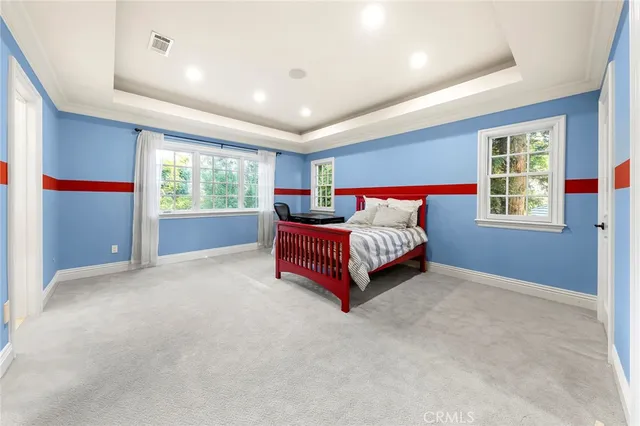 a view of a backyard with swimming pool