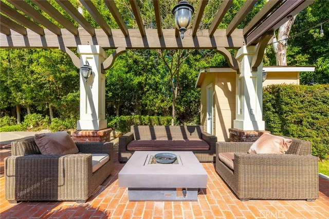 a view of a house with a backyard porch and sitting area