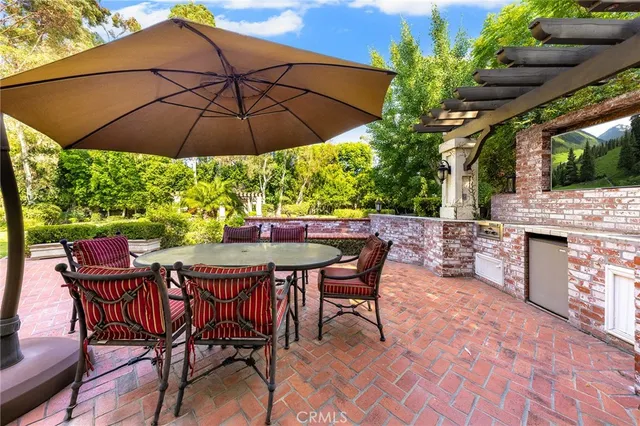 an aerial view of a house with a swimming pool