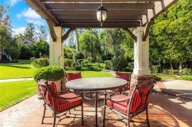an aerial view of residential houses with outdoor space and street view