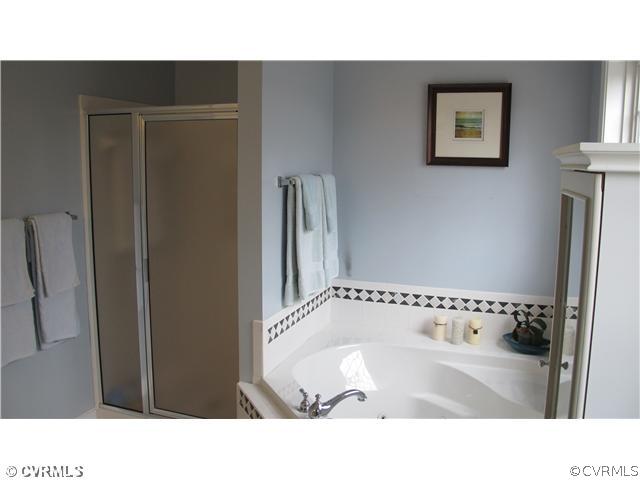 2545 Lochness Road Richmond, VA 23235 - Photo 13 of 20 a bathroom with a sink and a mirror