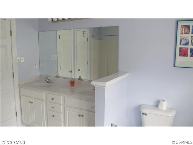 2545 Lochness Road Richmond, VA 23235 - Photo 19 of 20 a bathroom with a sink double vanity and a mirror