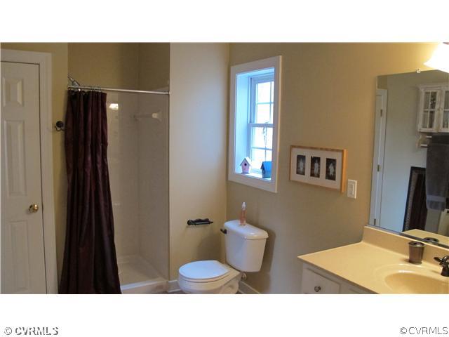 2545 Lochness Road Richmond, VA 23235 - Photo 20 of 20 a bathroom with a sink toilet and shower