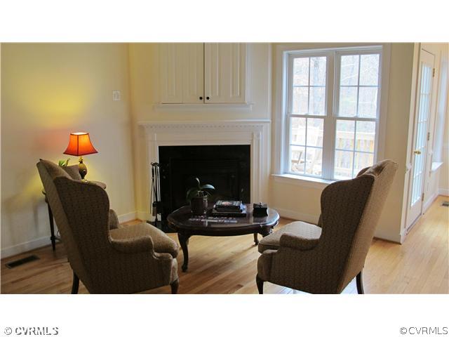 2545 Lochness Road Richmond, VA 23235 - Photo 2 of 20 a living room with furniture and a fireplace