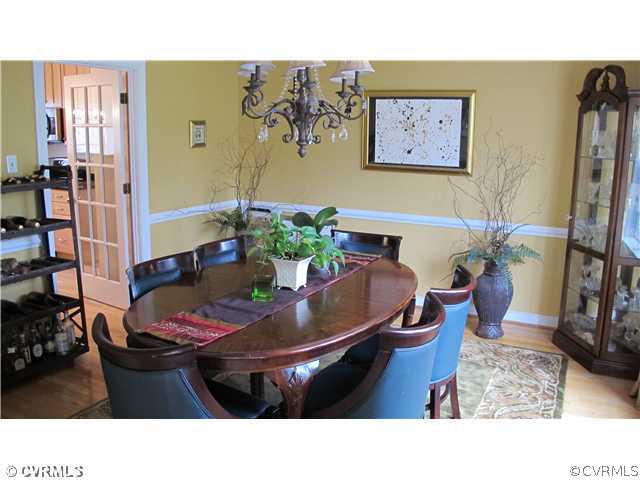 2545 Lochness Road Richmond, VA 23235 - Photo 7 of 20 a living room with furniture and flowers