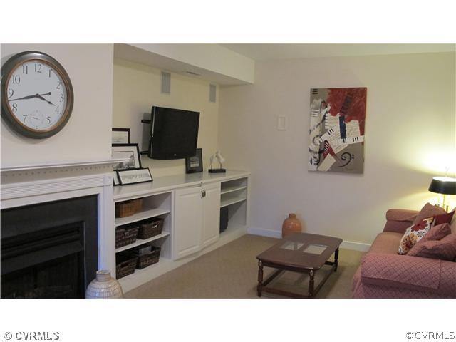 2545 Lochness Road Richmond, VA 23235 - Photo 8 of 20 a living room with furniture and a flat screen tv