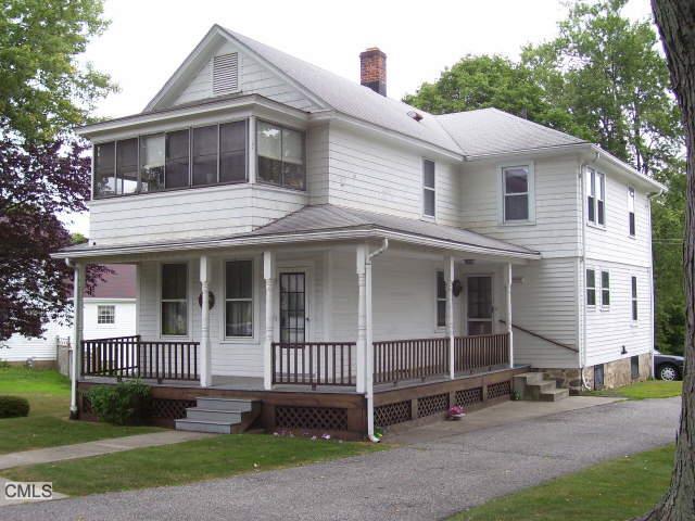 2040 Huntington Road Stratford, CT 06614 - Photo 1 of 1 a front view of a house with a yard