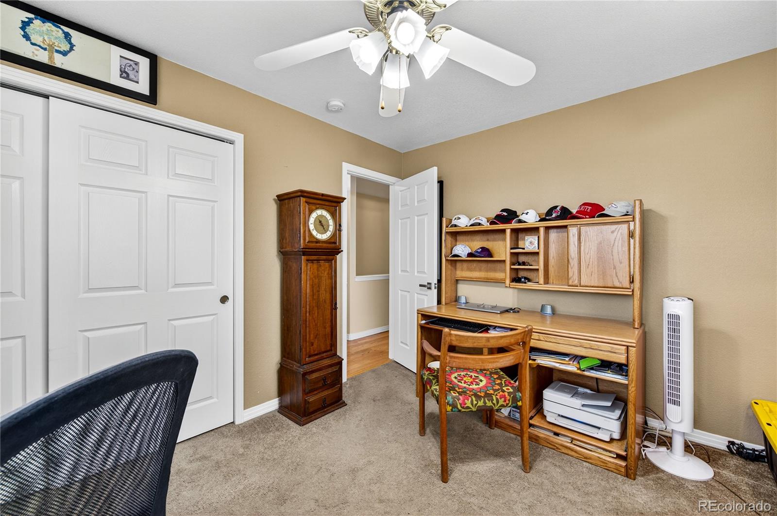 2464 Remington Road Elizabeth, CO 80107 - Photo 13 of 41 a view of a bedroom with furniture and windows
