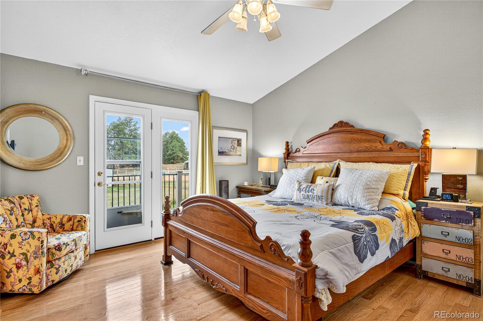 2464 Remington Road Elizabeth, CO 80107 - Photo 17 of 41 a bedroom with a bed and a chandelier