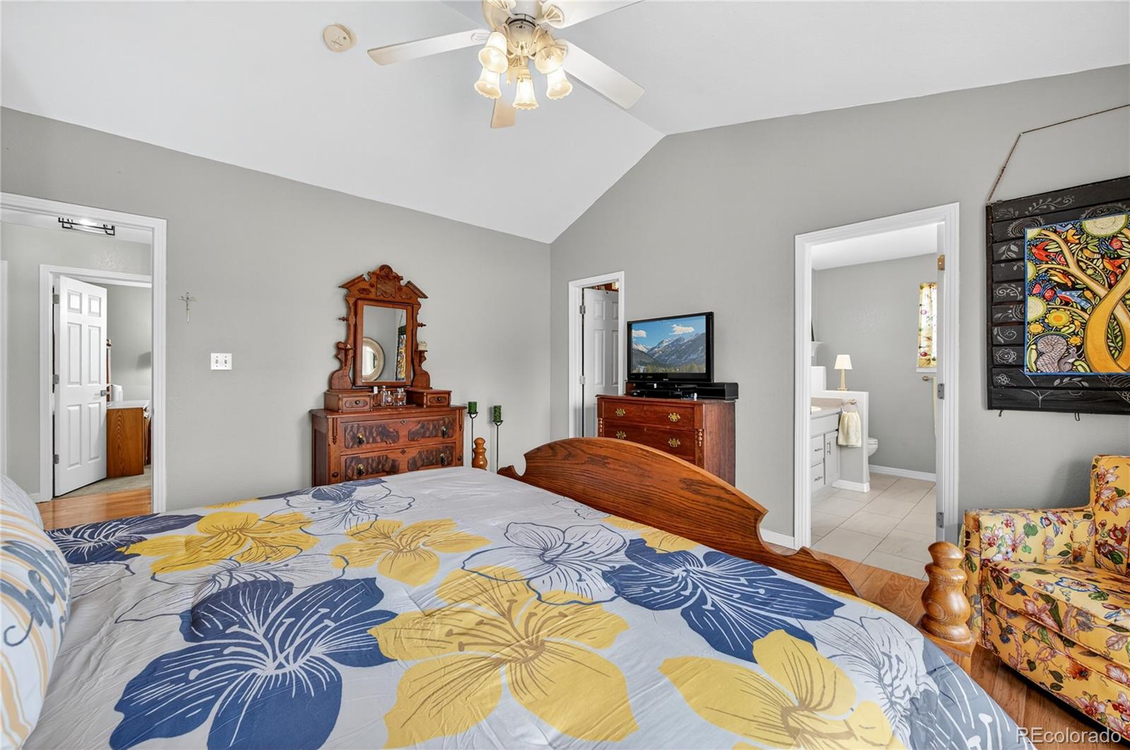 2464 Remington Road Elizabeth, CO 80107 - Photo 18 of 41 a bedroom with a bed and a chandelier