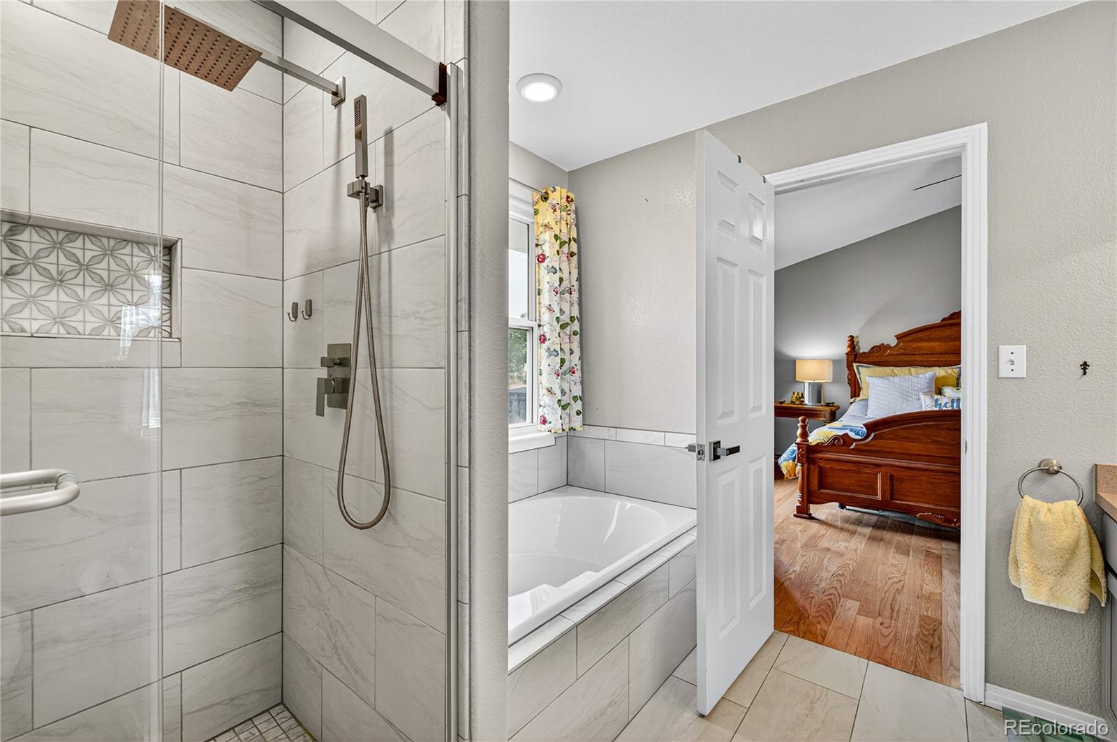 2464 Remington Road Elizabeth, CO 80107 - Photo 20 of 41 a bathroom with a tub shower and vanity