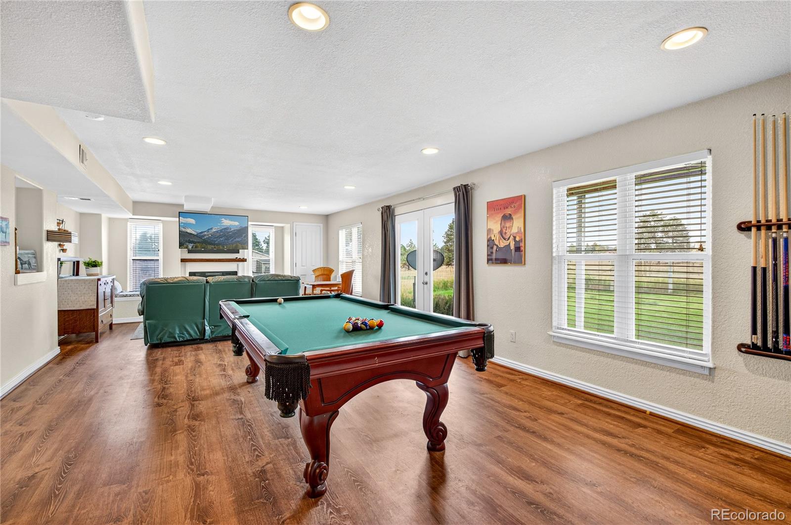 2464 Remington Road Elizabeth, CO 80107 - Photo 22 of 41 a room with furniture and a open kitchen view