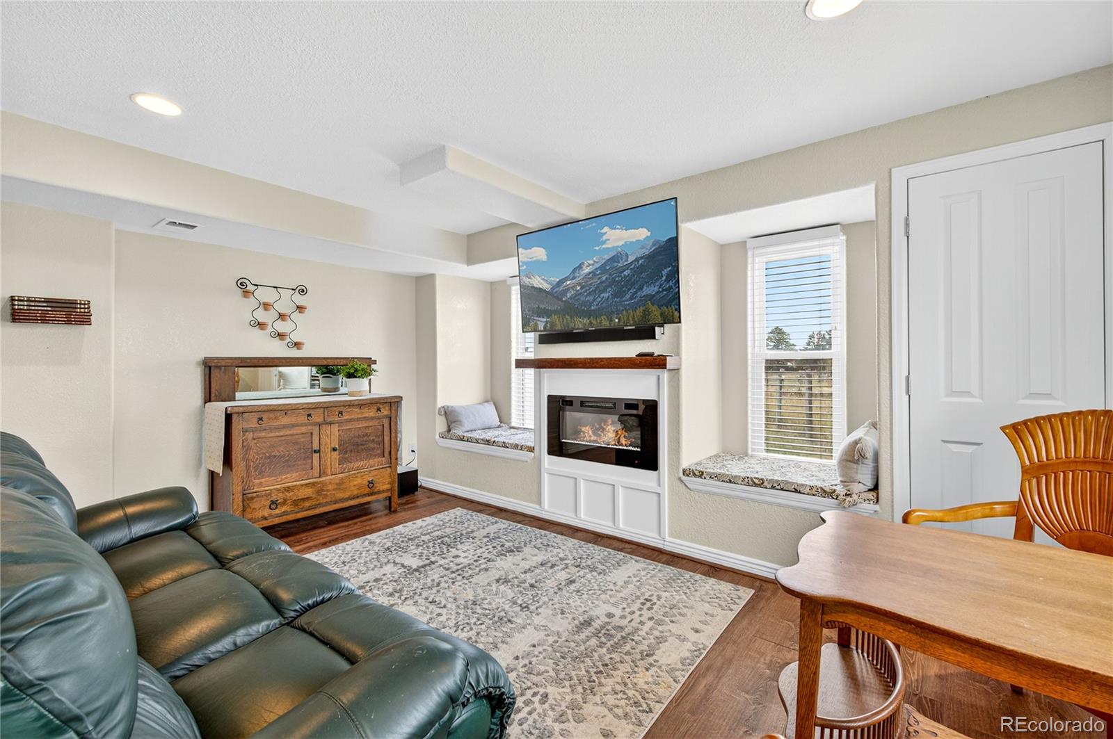 2464 Remington Road Elizabeth, CO 80107 - Photo 23 of 41 a living room with furniture and a fireplace