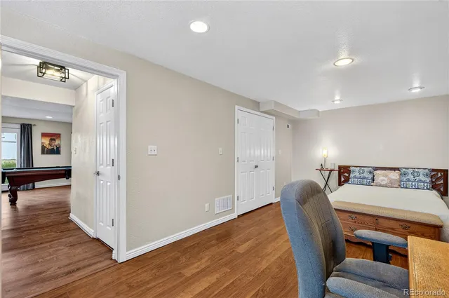 a view of a livingroom with furniture and wooden floor