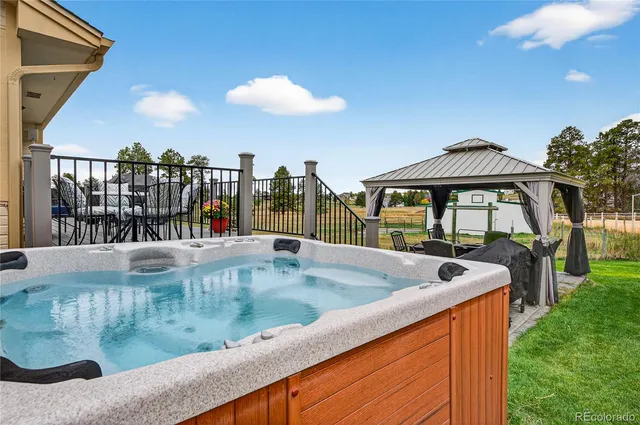 a view of a swimming pool and dinning table and chairs