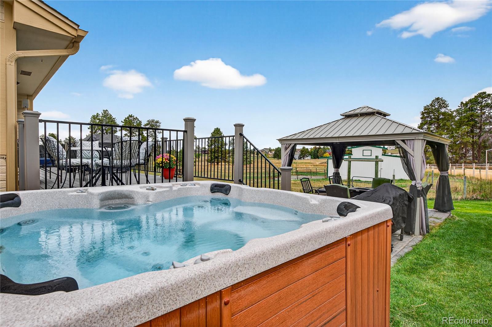 2464 Remington Road Elizabeth, CO 80107 - Photo 31 of 41 a view of a swimming pool and dinning table and chairs