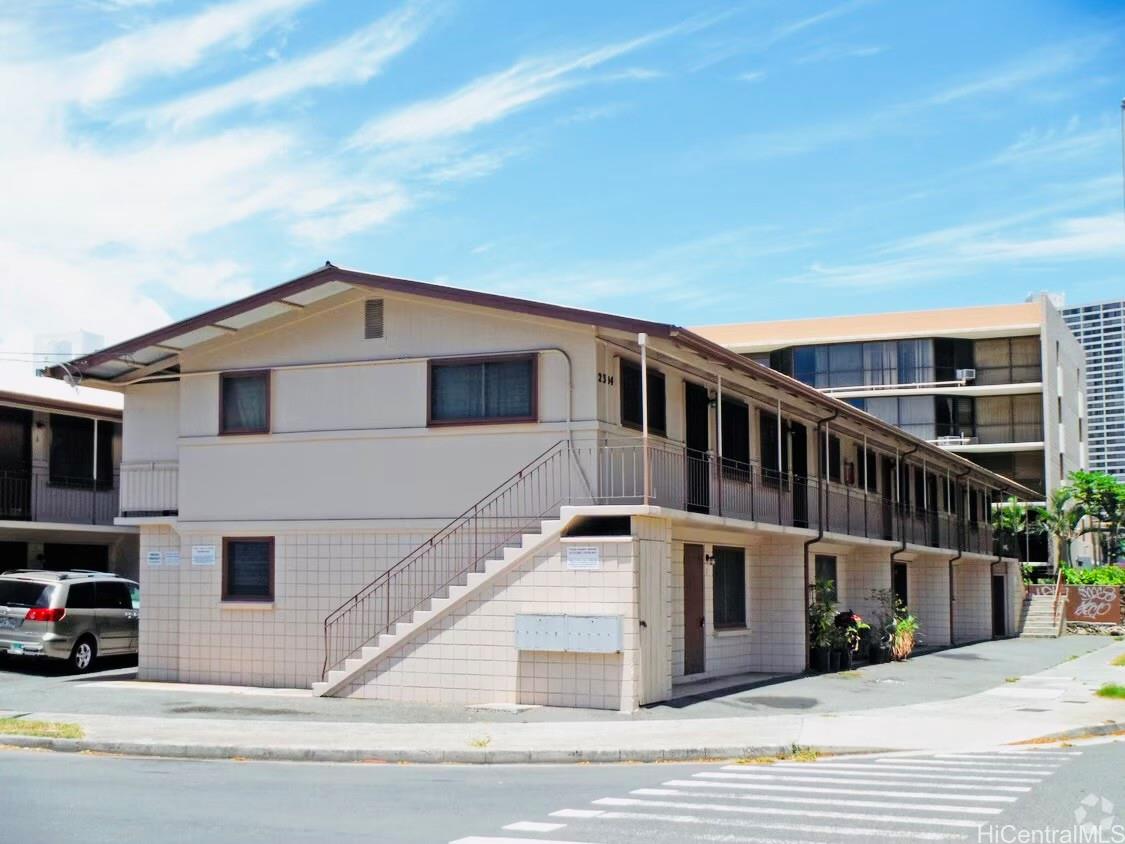 705 Hoawa Street Honolulu, HI 96826 - Photo 2 of 8 a view of a house with a balcony