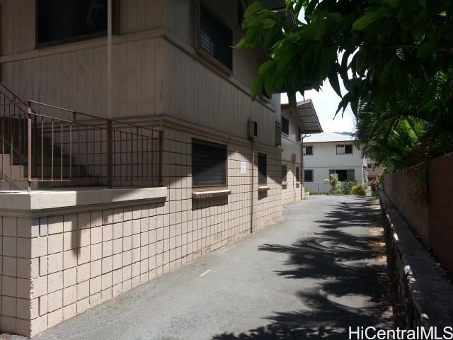 705 Hoawa Street Honolulu, HI 96826 - Photo 4 of 8 a view of a street with car parked