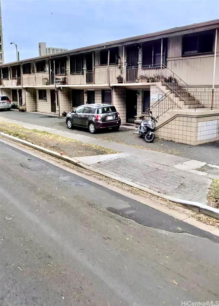 705 Hoawa Street Honolulu, HI 96826 - Photo 5 of 8 a car parked in front of a building