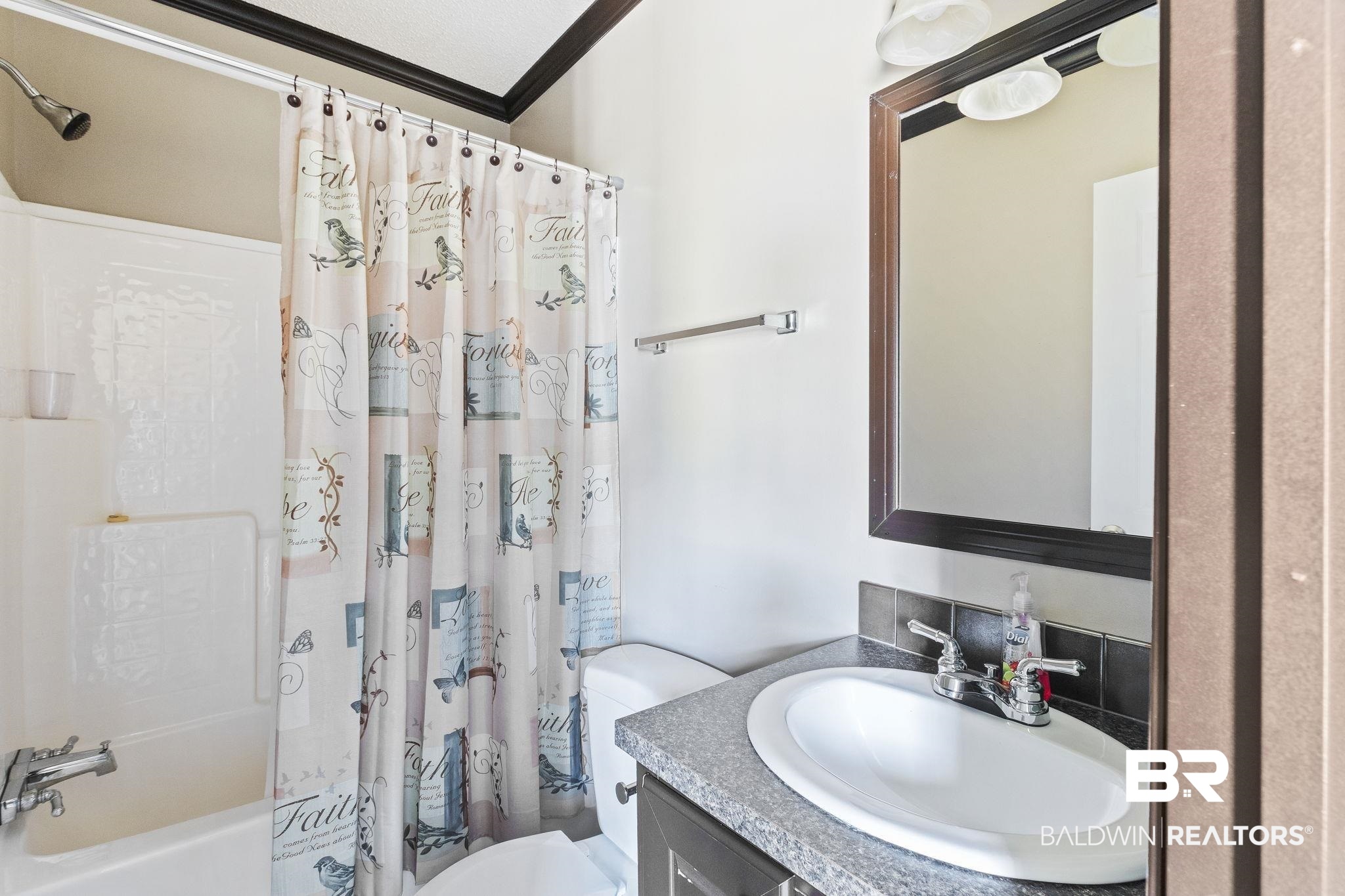 6870 Cecilia Court Theodore, AL 36582 - Photo 47 of 83 Full bathroom featuring ornamental molding, vanity, shower / tub combo, and toilet