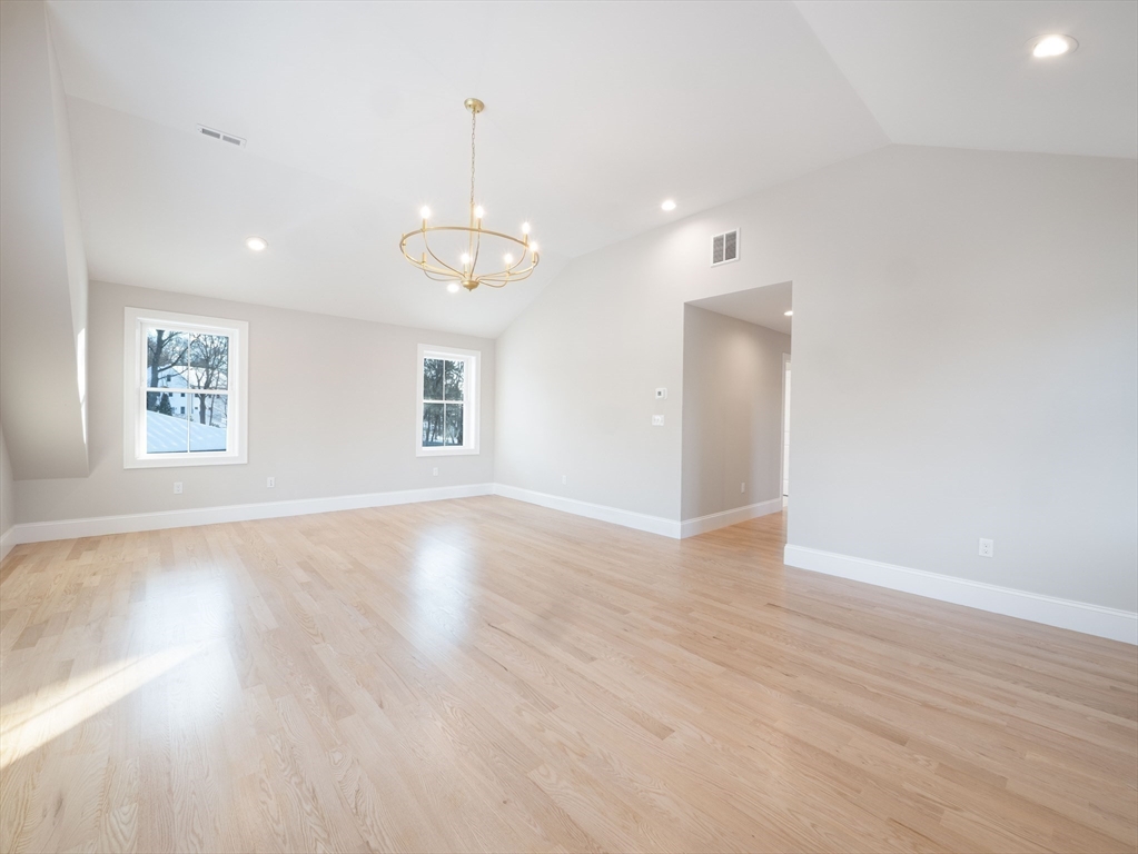 22 Bradford Road Natick, MA 01760 - Photo 22 of 37 an empty room with wooden floor and windows