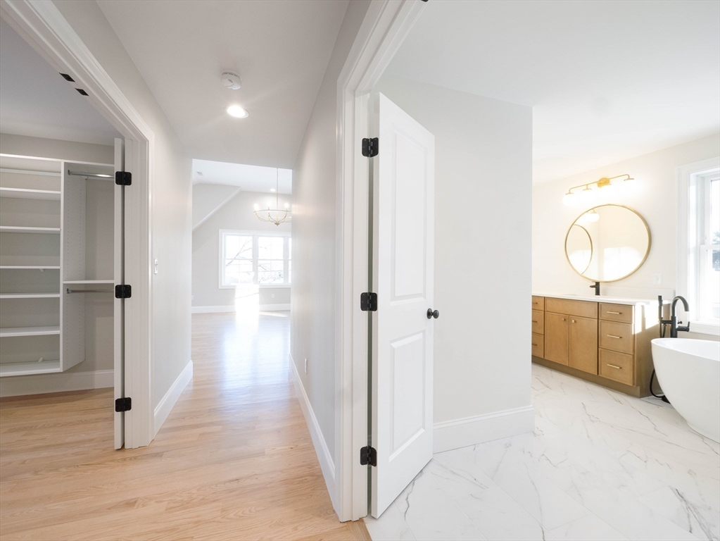 22 Bradford Road Natick, MA 01760 - Photo 26 of 37 a view of a room with wooden floor mirror and windows