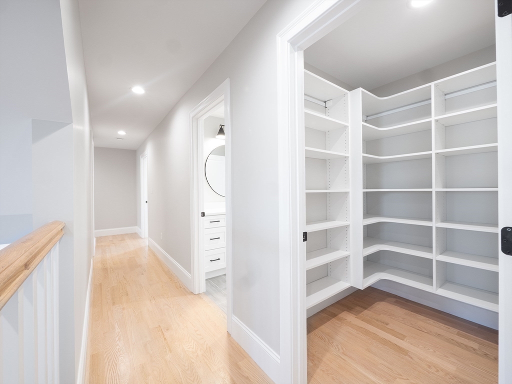 22 Bradford Road Natick, MA 01760 - Photo 33 of 37 a view of walk in closet with empty racks