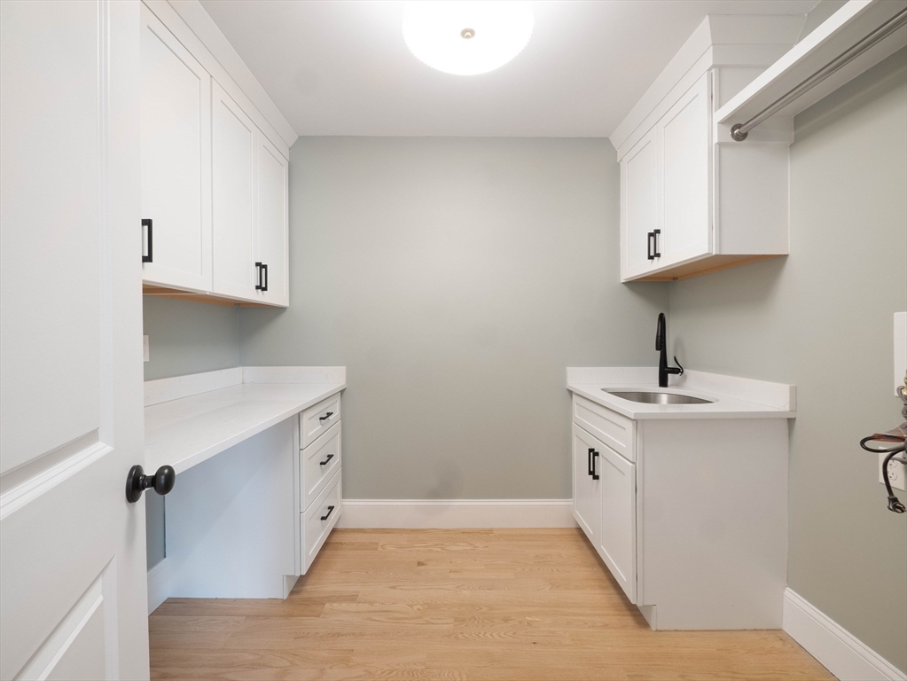 22 Bradford Road Natick, MA 01760 - Photo 34 of 37 a kitchen with a sink and cabinets