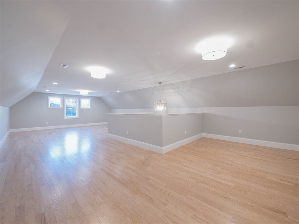22 Bradford Road Natick, MA 01760 - Photo 37 of 37 an empty room with wooden floor and windows