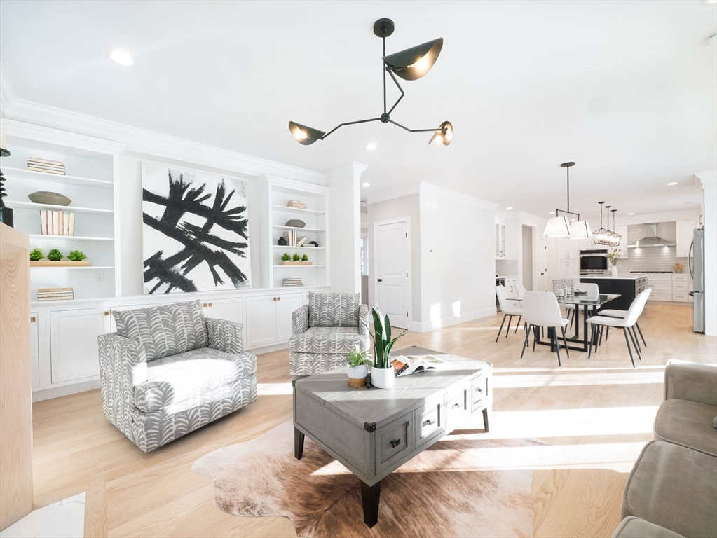 22 Bradford Road Natick, MA 01760 - Photo 10 of 37 a living room with furniture and a large window