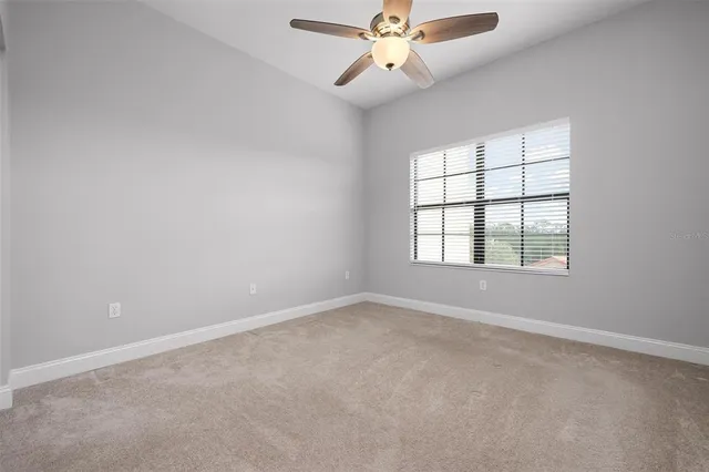 a bathroom with a shower sink and mirror