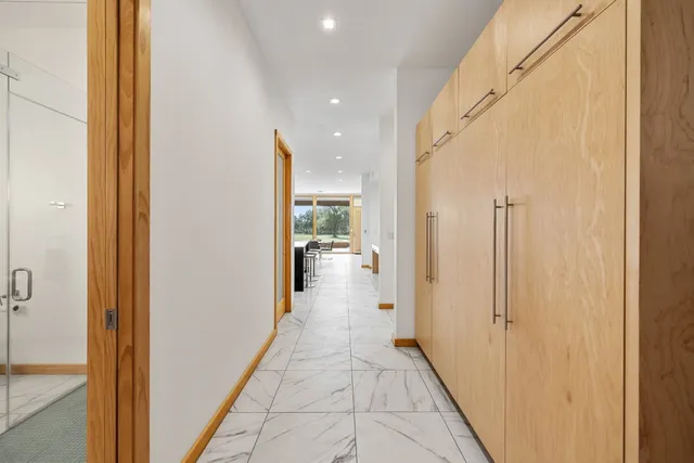 a view of a hallway with a hallway and a living room