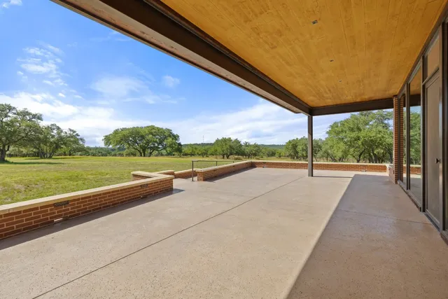 a view of a garden with an outdoor seating