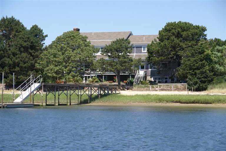 58 Old Salt Works Road Chatham, MA 02633 - Photo 1 of 15 a view of a house with a yard and a garden