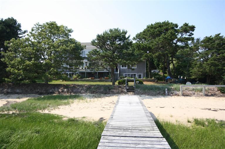 58 Old Salt Works Road Chatham, MA 02633 - Photo 12 of 15 a swimming pool with outdoor seating and yard
