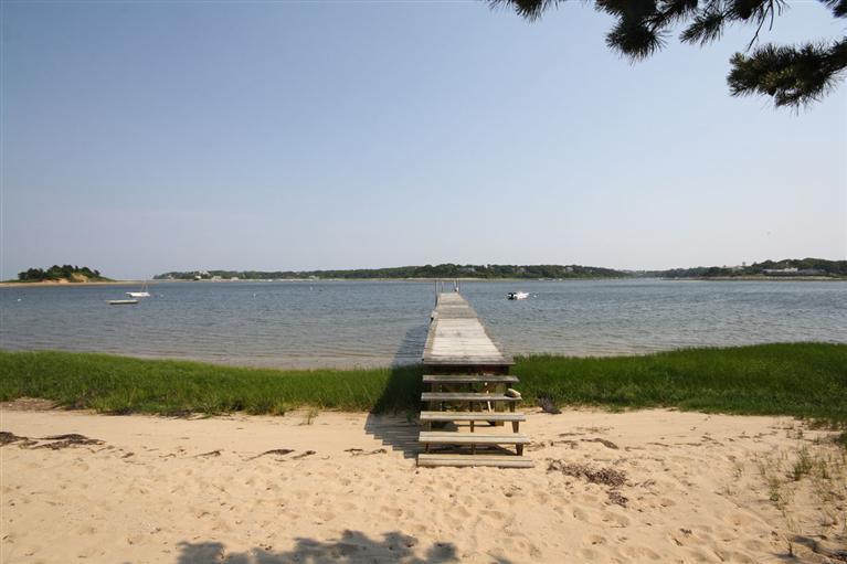 58 Old Salt Works Road Chatham, MA 02633 - Photo 3 of 15 a view of a lake with a beach