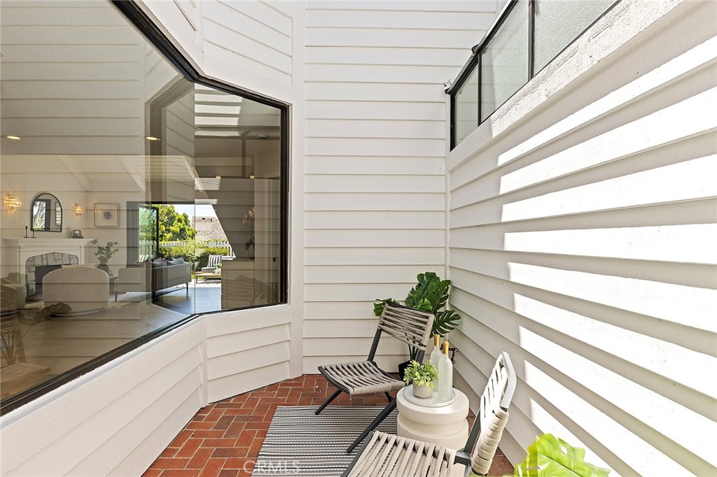 23966 Wanigan Way Laguna Niguel, CA 92677 - Photo 11 of 57 a view of a balcony with chairs and a potted plant