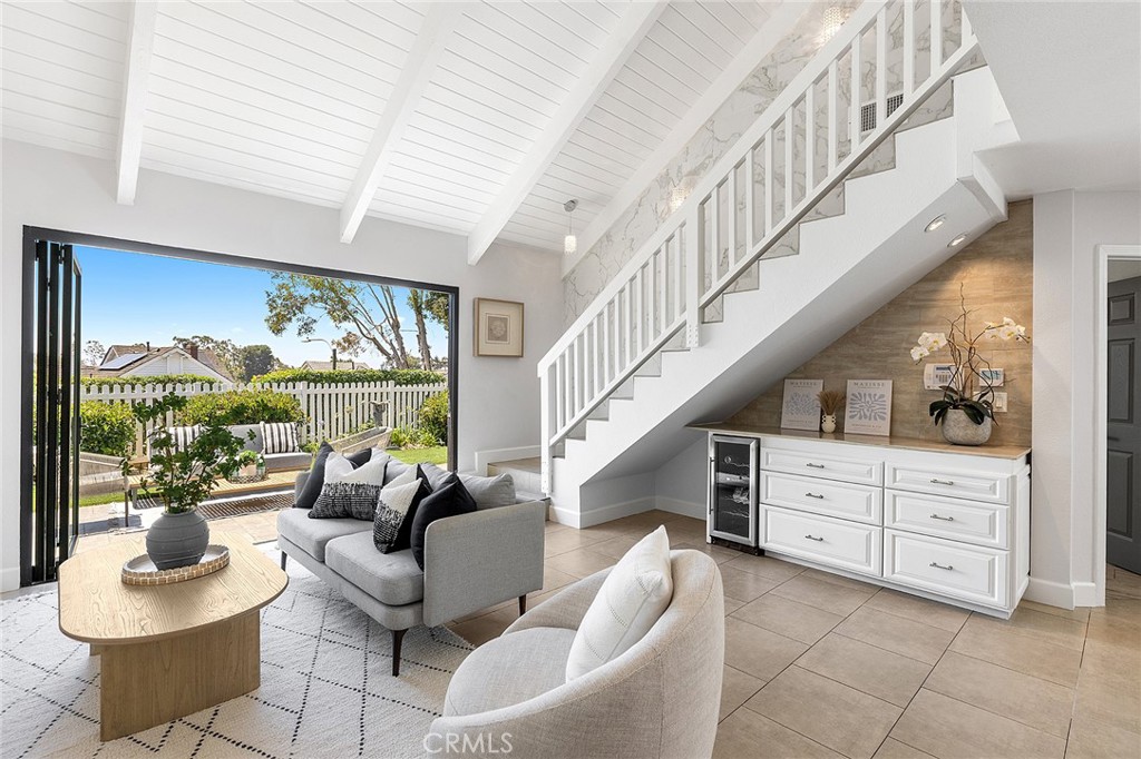 23966 Wanigan Way Laguna Niguel, CA 92677 - Photo 15 of 57 a living room with furniture and a large window