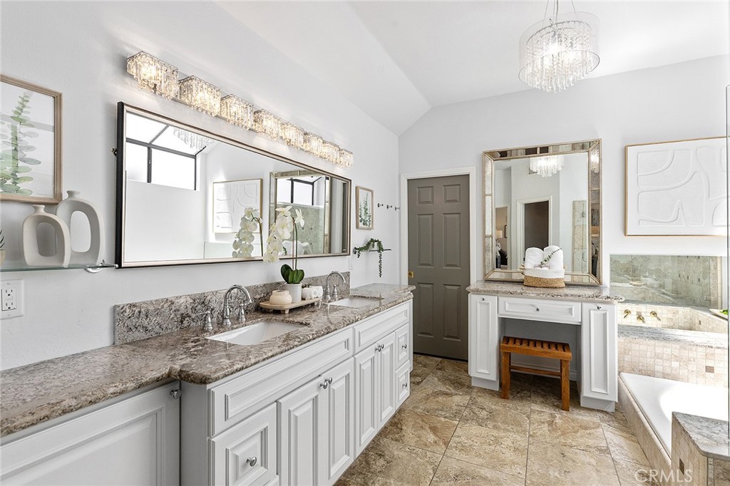 23966 Wanigan Way Laguna Niguel, CA 92677 - Photo 25 of 57 a spacious bathroom with sinks granite countertop a sink and a large mirror