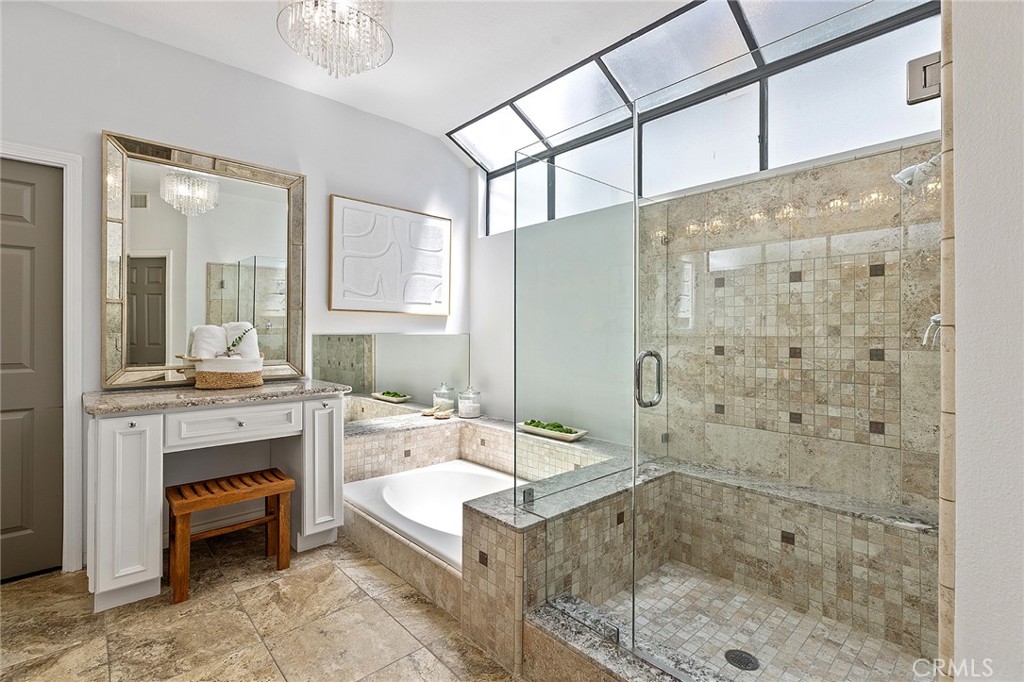 23966 Wanigan Way Laguna Niguel, CA 92677 - Photo 27 of 57 a bathroom with a granite countertop double vanity sink a mirror and a shower