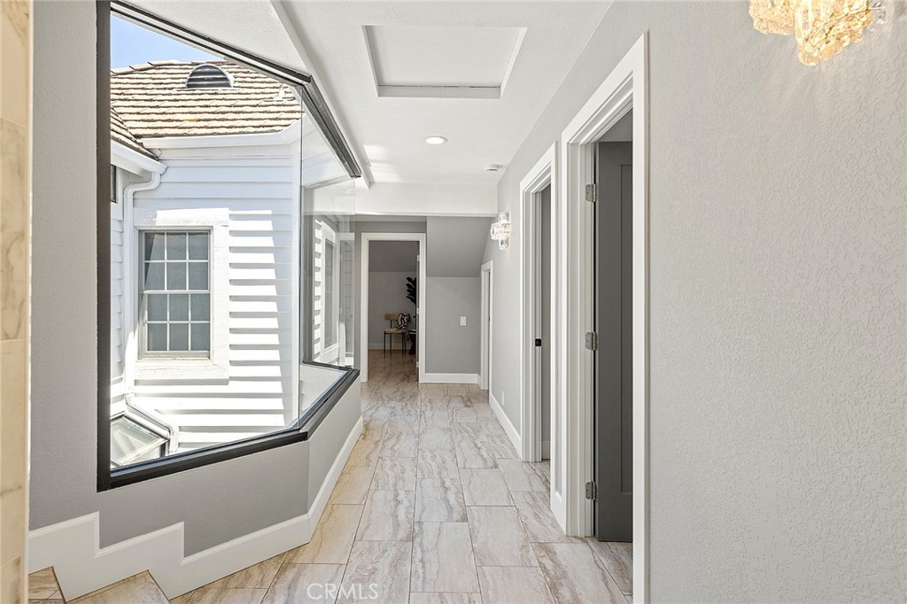 23966 Wanigan Way Laguna Niguel, CA 92677 - Photo 30 of 57 a view of a hallway with wooden floor and staircase