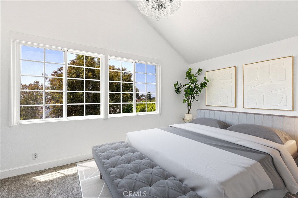 23966 Wanigan Way Laguna Niguel, CA 92677 - Photo 31 of 57 a bedroom with a bed and a window