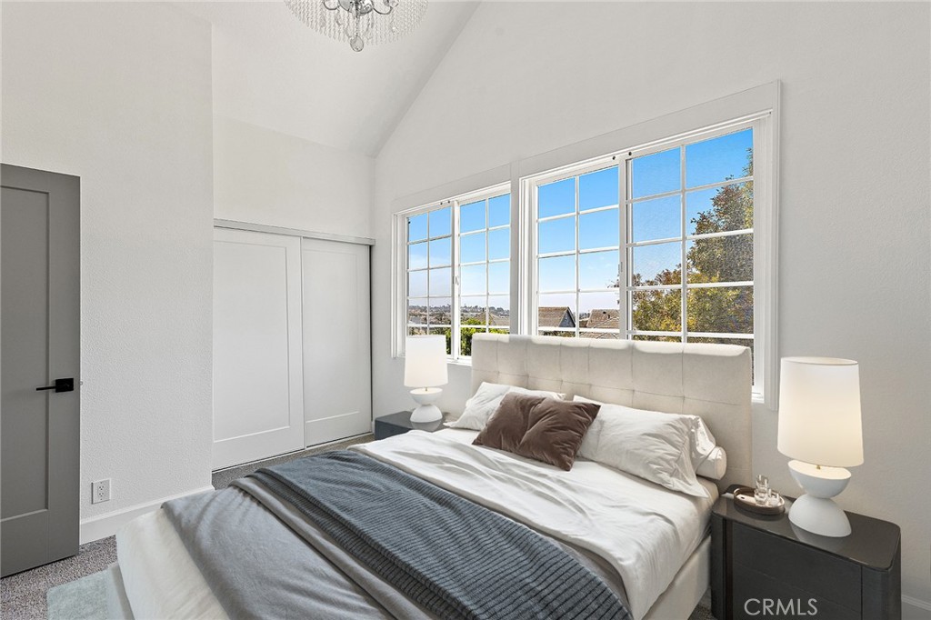 23966 Wanigan Way Laguna Niguel, CA 92677 - Photo 32 of 57 a bedroom with a bed and a window