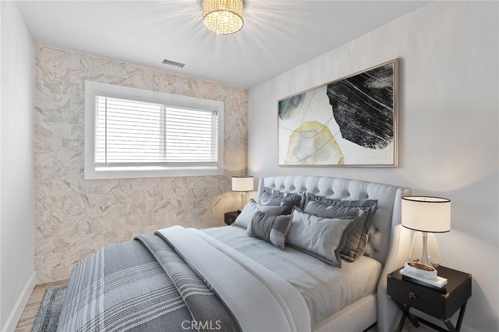 23966 Wanigan Way Laguna Niguel, CA 92677 - Photo 36 of 57 a bedroom with a bed and a lamp