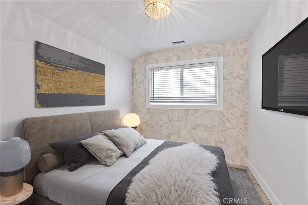 23966 Wanigan Way Laguna Niguel, CA 92677 - Photo 38 of 57 a bedroom with a bed couch and window