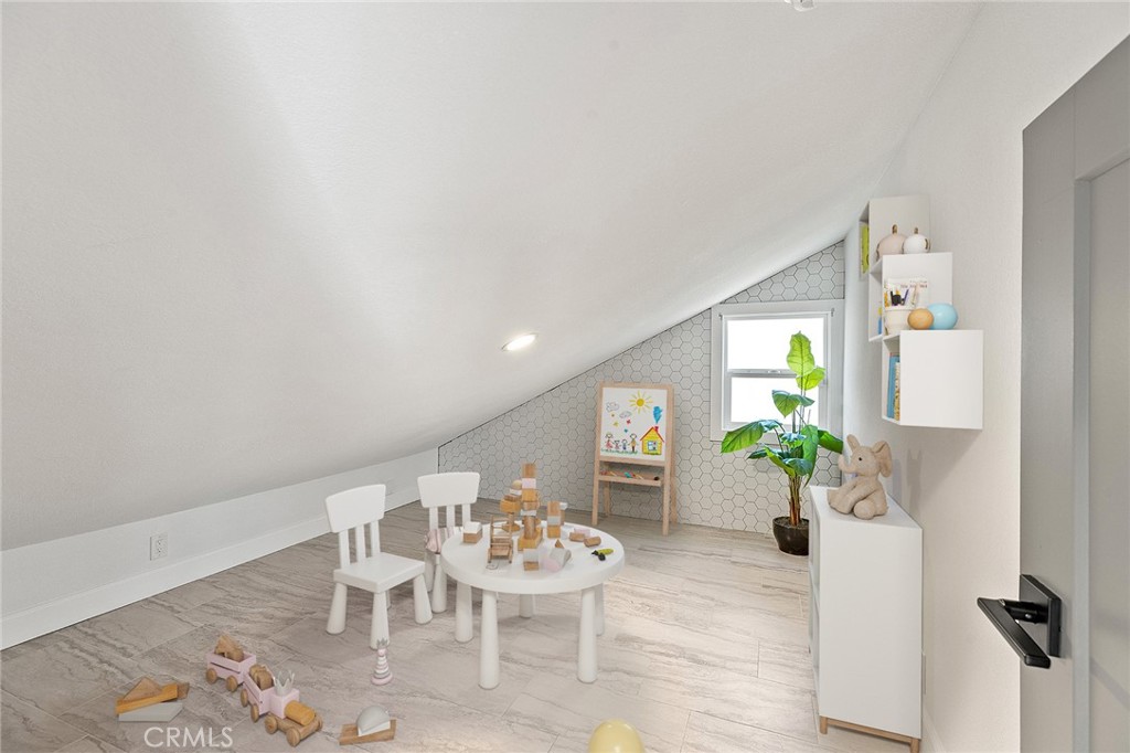 23966 Wanigan Way Laguna Niguel, CA 92677 - Photo 39 of 57 a view of a dining room with furniture and a potted plant