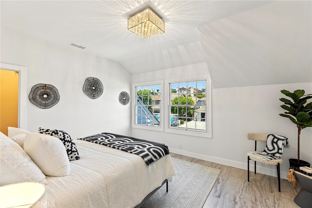 23966 Wanigan Way Laguna Niguel, CA 92677 - Photo 40 of 57 a bedroom with a bed and a window