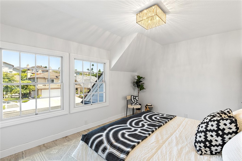 23966 Wanigan Way Laguna Niguel, CA 92677 - Photo 43 of 57 a bedroom with a bed and a window
