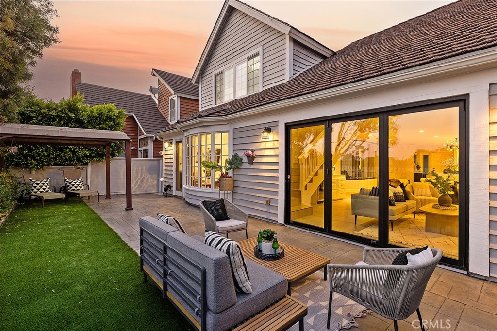 23966 Wanigan Way Laguna Niguel, CA 92677 - Photo 52 of 57 a view of a patio with couches table and chairs and potted plants